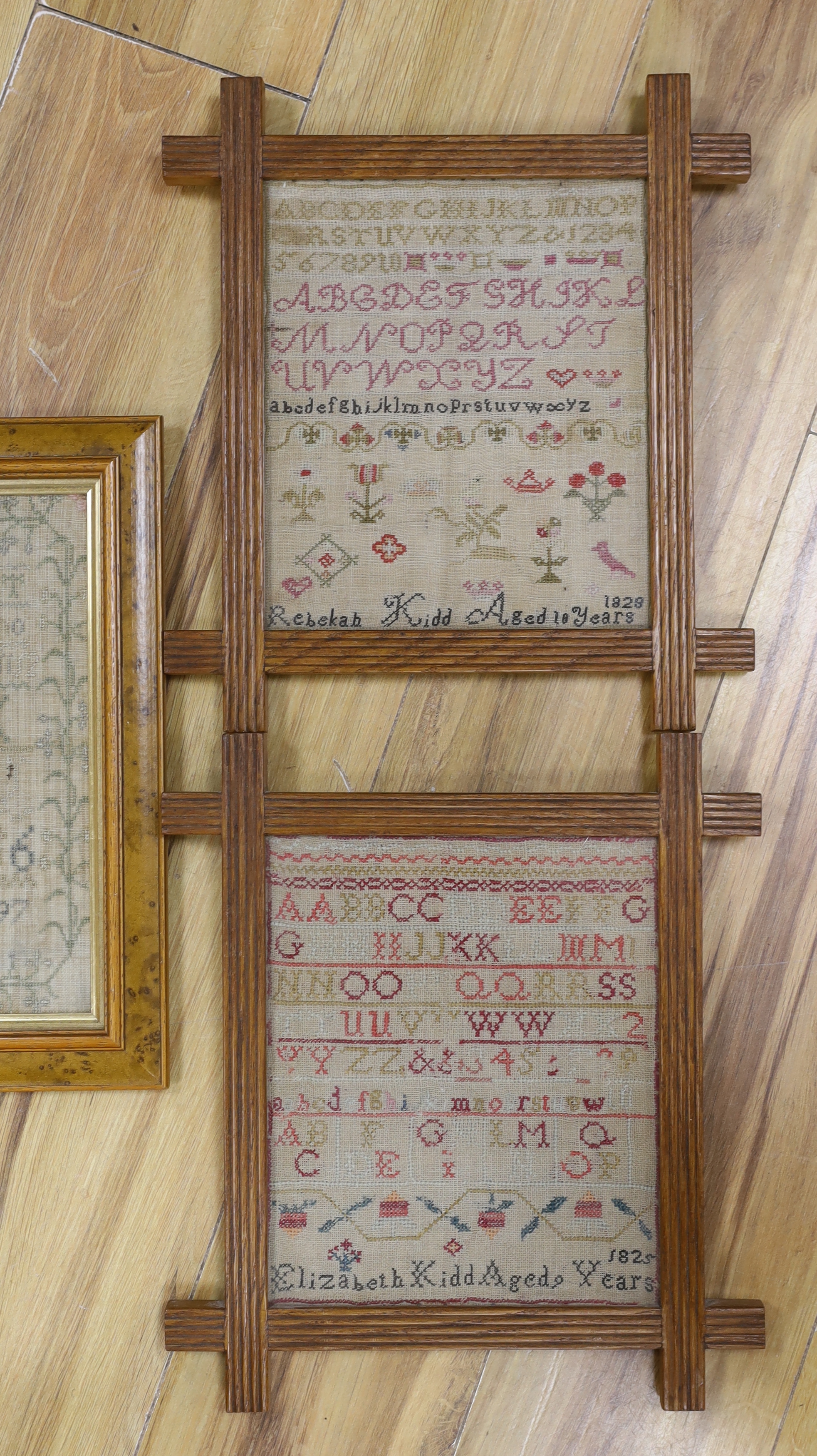 A George III dated 1797 framed alphabet sampler, by Barbara Darling and two similar dated samplers 1825 and 1828 by Elizabeth Kidd, together with a later undated 19th century sampler by Jane Kennedy (4)